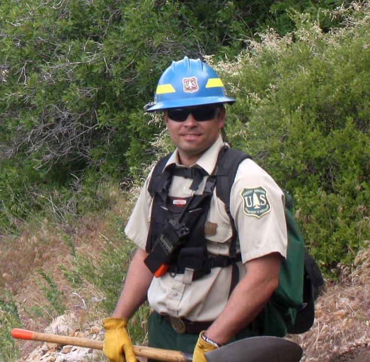 Photo of Forest Service district ranger Matthew Zumstein out in the field