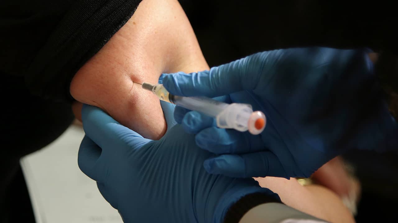 Photo of a woman getting a vaccine in New York