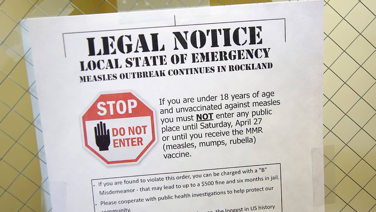 Photo of sign explaining the local state of emergency because of a measles outbreak