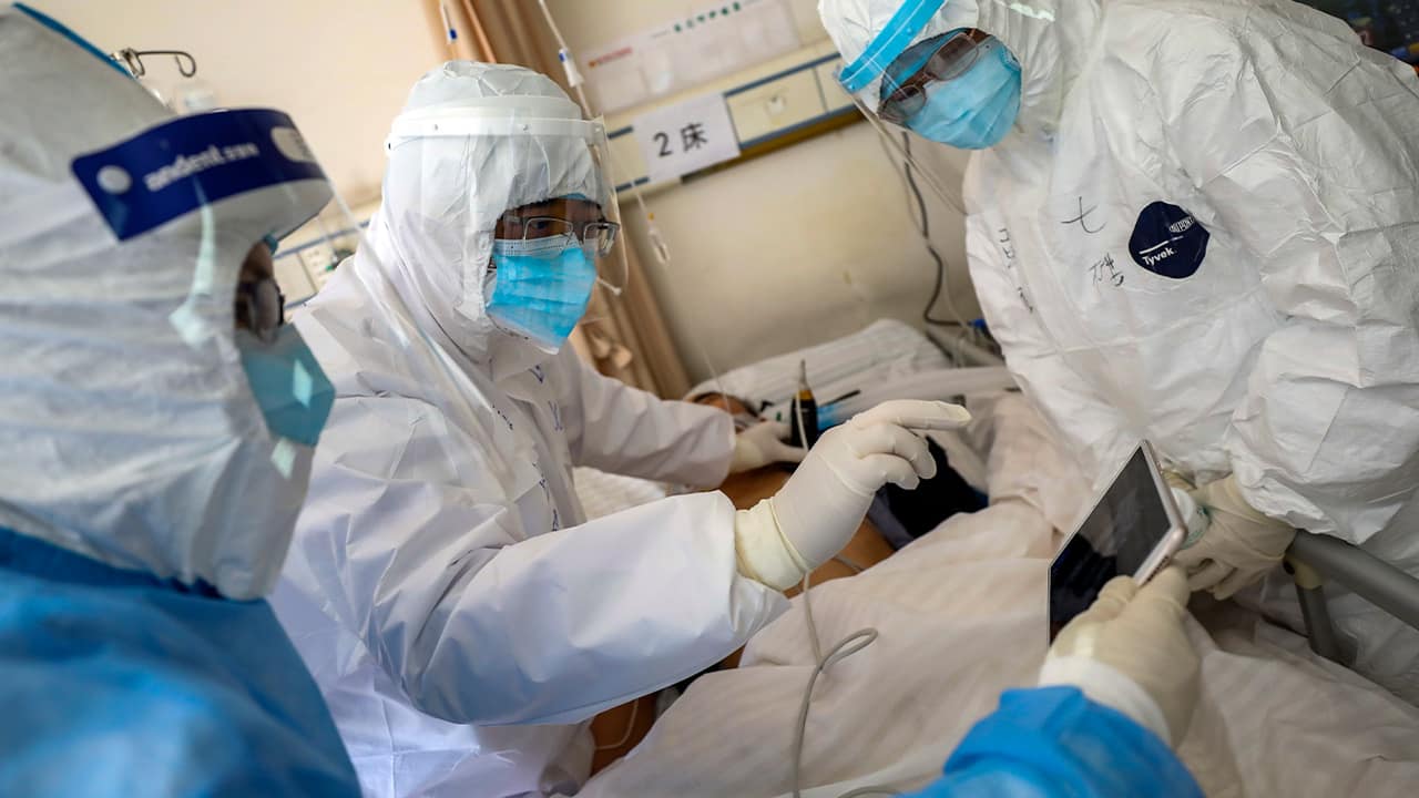 Photo of medical personnel scanning a patient 