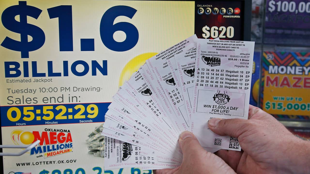 Photo of customer holding Mega Millions lottery tickets in Oklahoma City