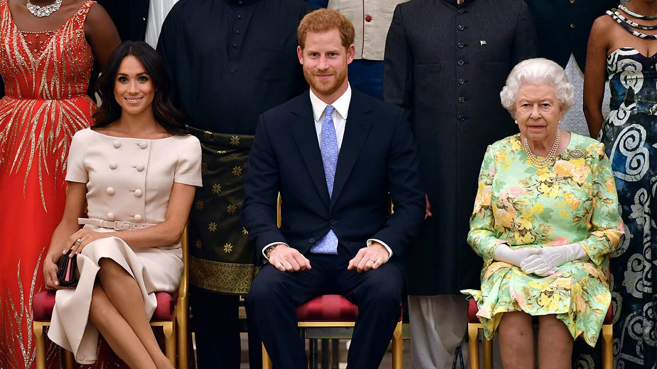 Photo of Meghan, Prince Harry, and Queen Elizabeth II 