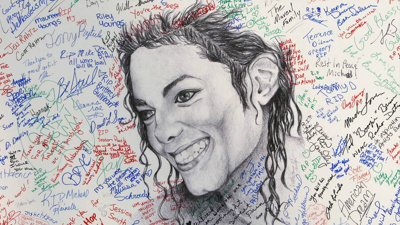 Photo of signatures on a poster of Michael Jackson 