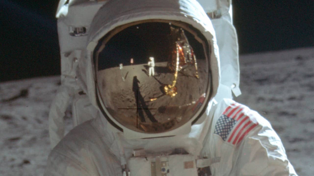 Photo of astronaut Neil Armstrong reflected in the helmet of Buzz Aldrin