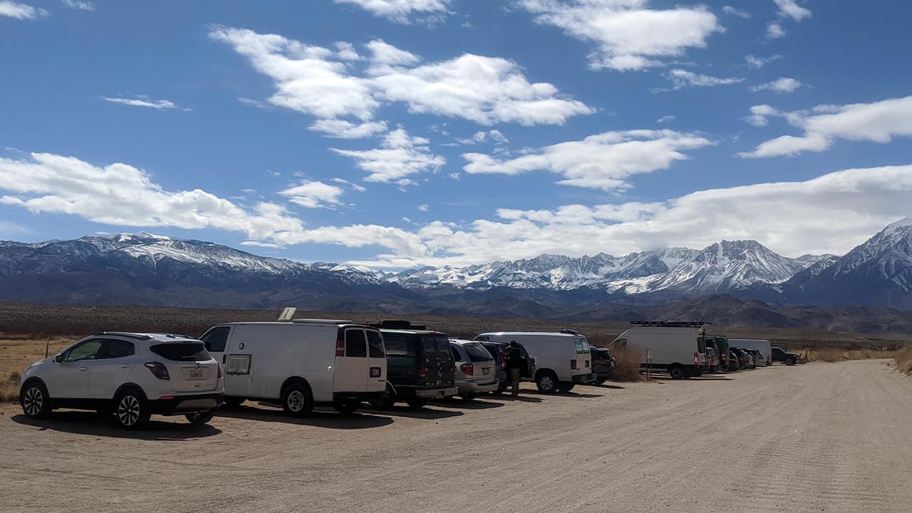 Photo of a dirt road with mountains in the background in Bishop, Calif.
