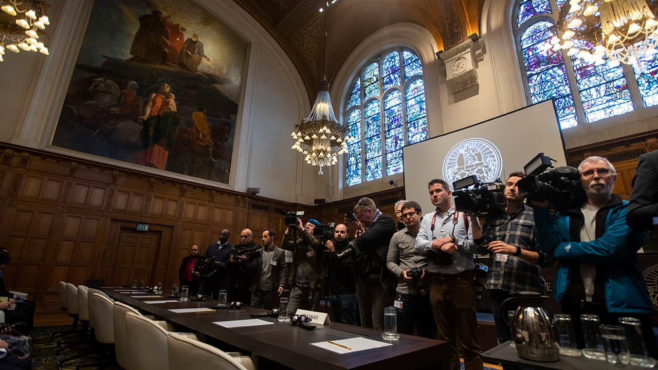 Photo of journalists waiting in the court room 