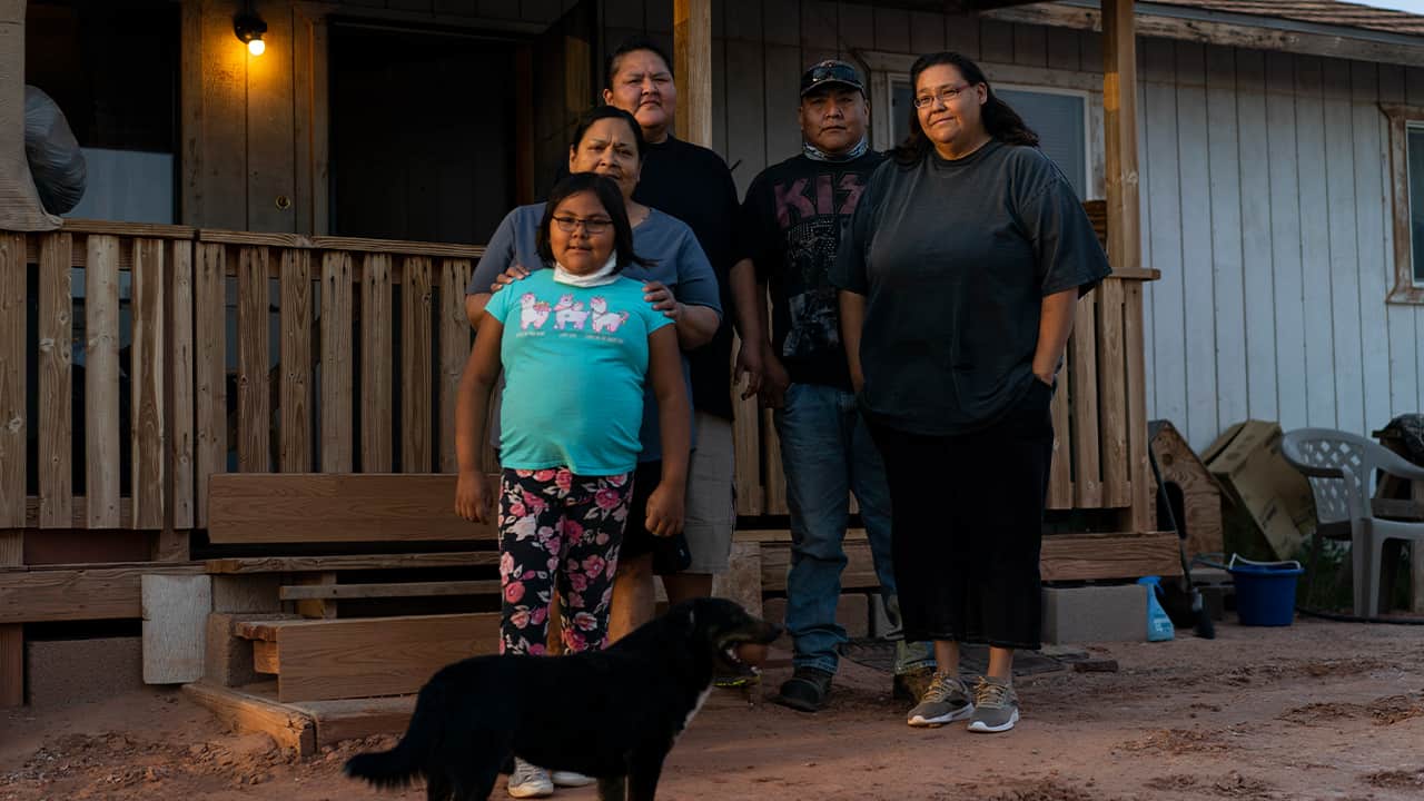 Photo of Annabelle Dinehdeal, 8; Maria Cruz, Christina Dinehdeal, Eugene Dinehdeal, Angelina Dinehdeal, and their dog, Wally 