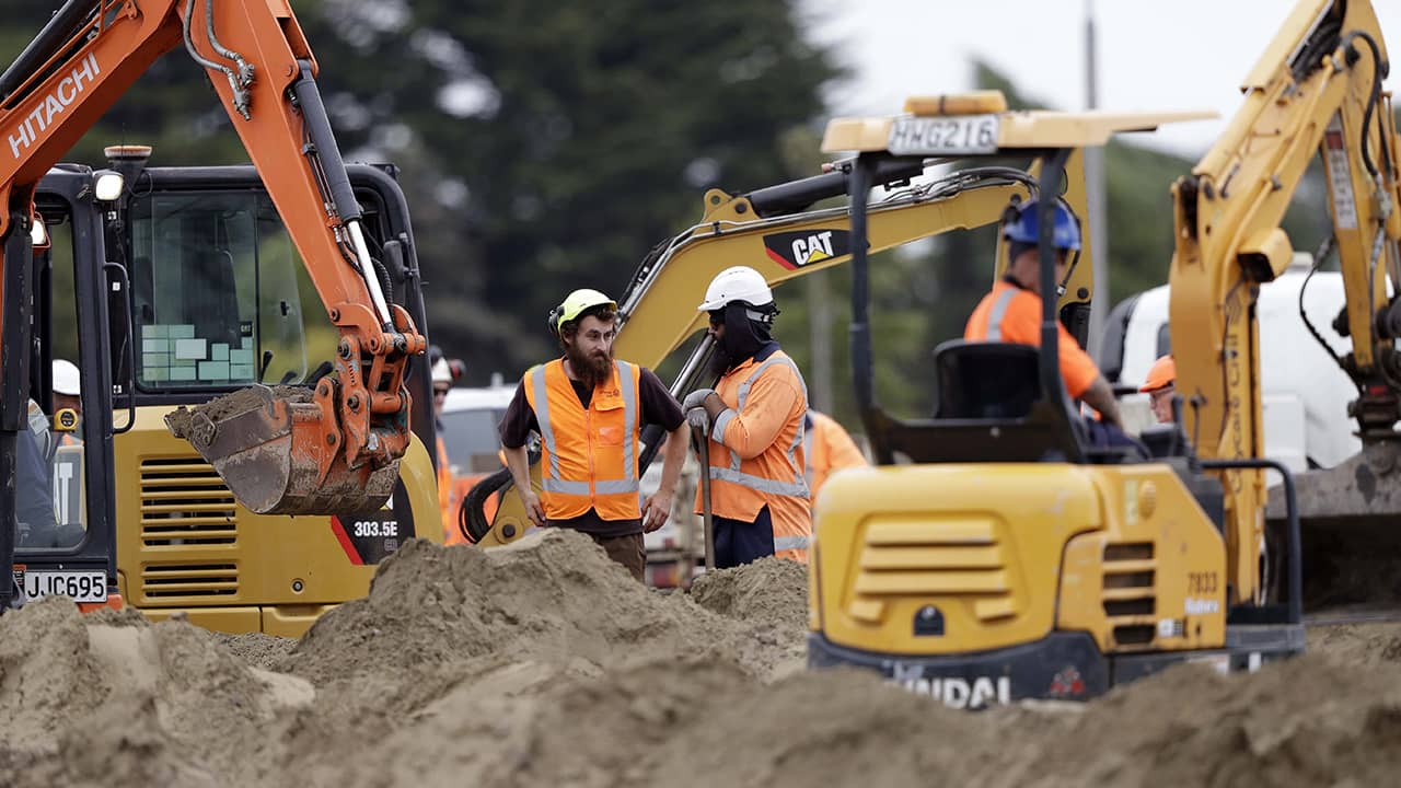 Photo of workers preparing Muslim cemetery