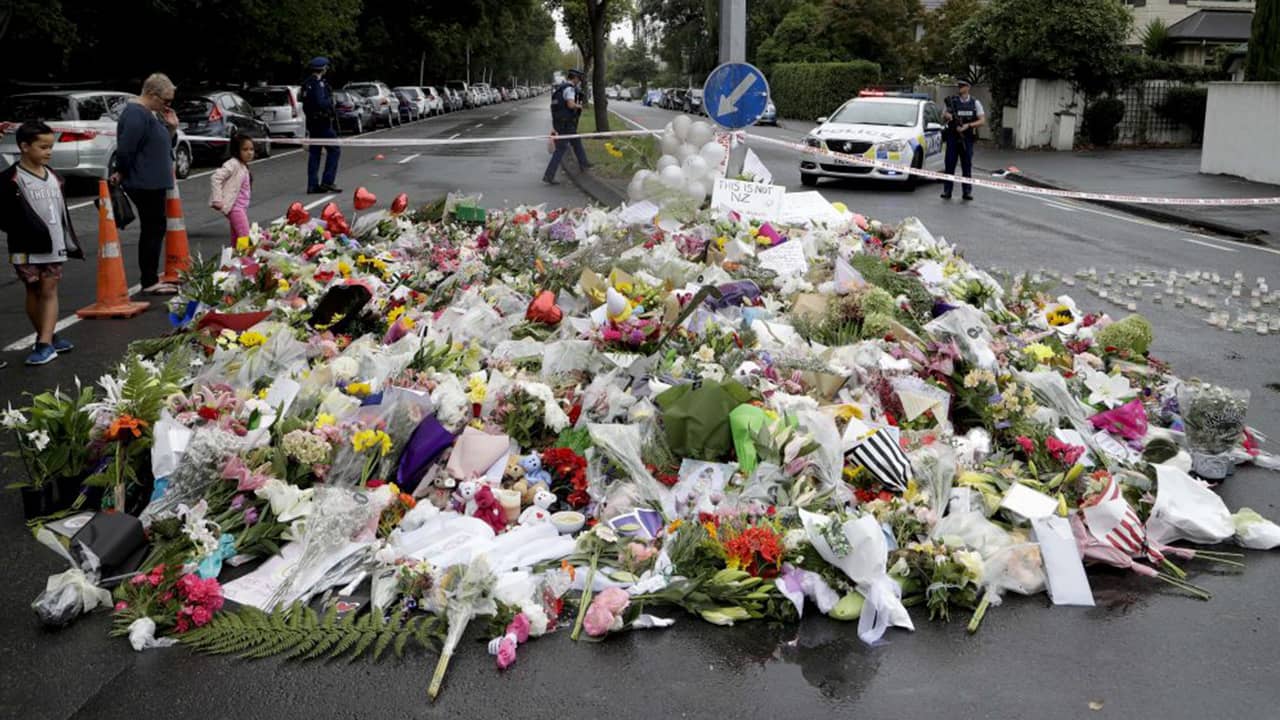 Photo of a pile of flowers near a mosque in New Zealand