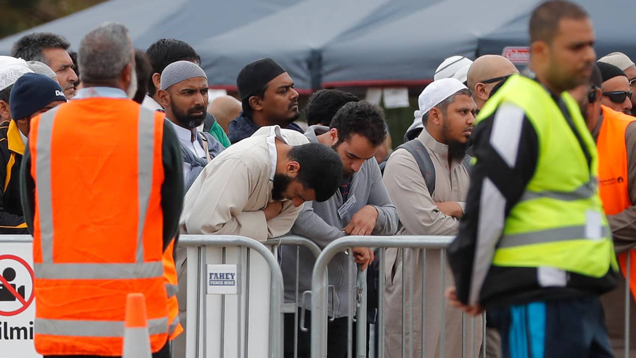 Photo of mourners attending service for a victim of the mosque shootings