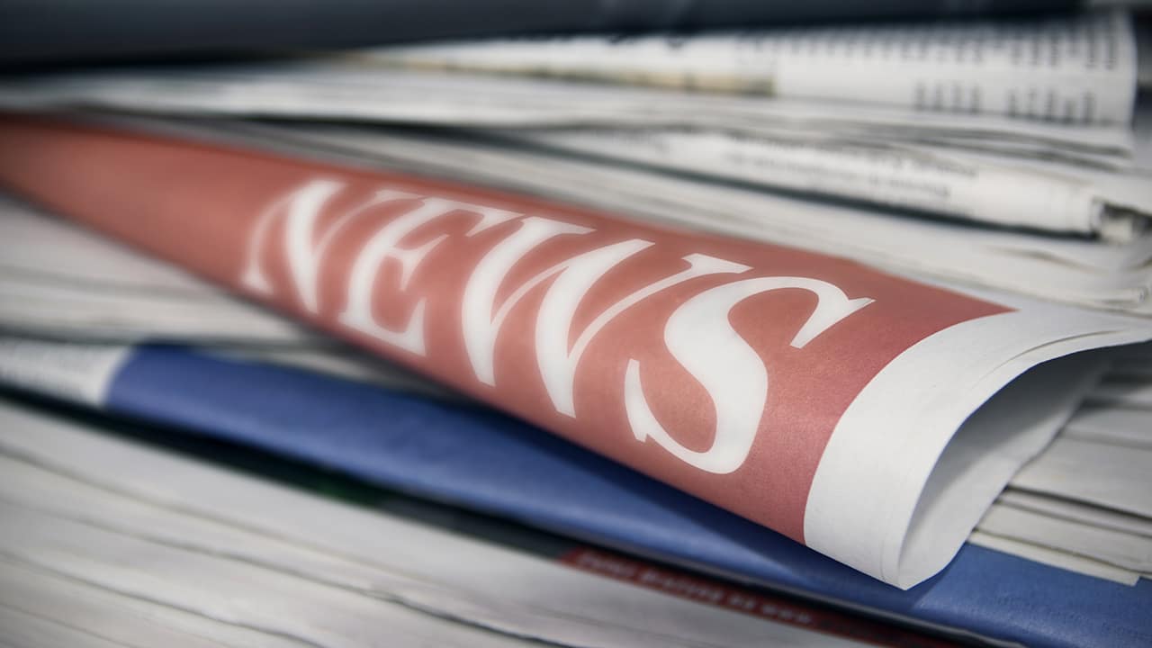 Photo of newspapers stacked up with the word "news" showing