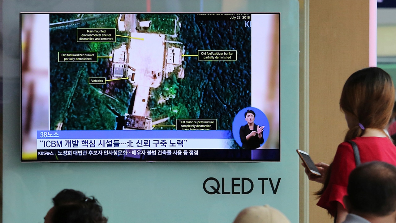 Photo of TV screen showing a satellite image of North Korea's Sohae launch site