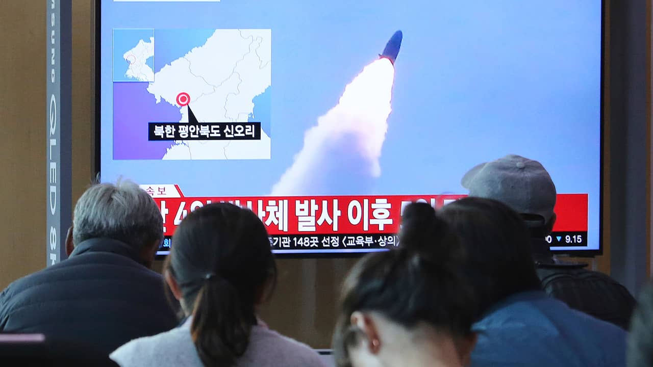 Photo of people watching North Korea's missile launch
