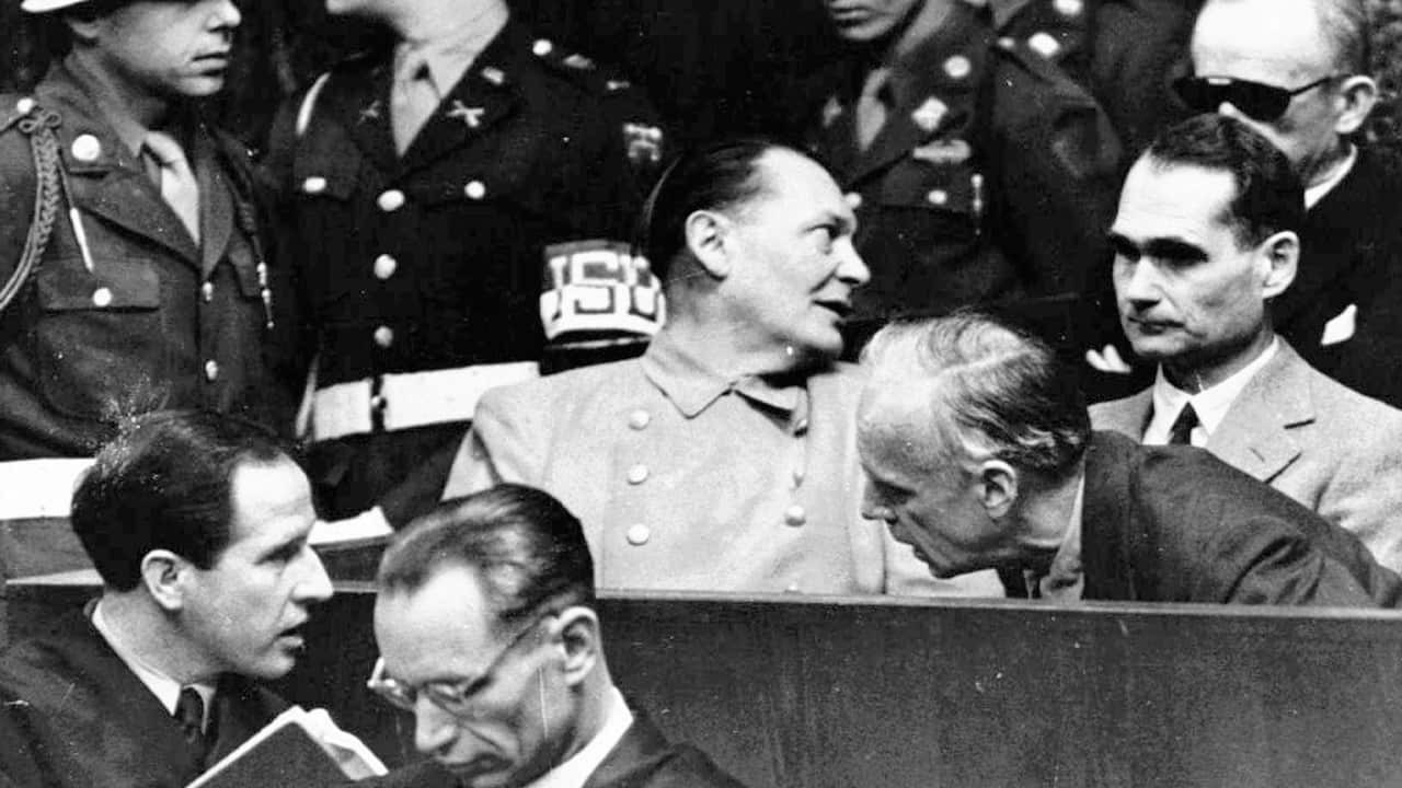 Photo of Nazi German Foreign Minister Joachim von Ribbentrop, right, leans in front of Rudolf Hess, Hitler's deputy