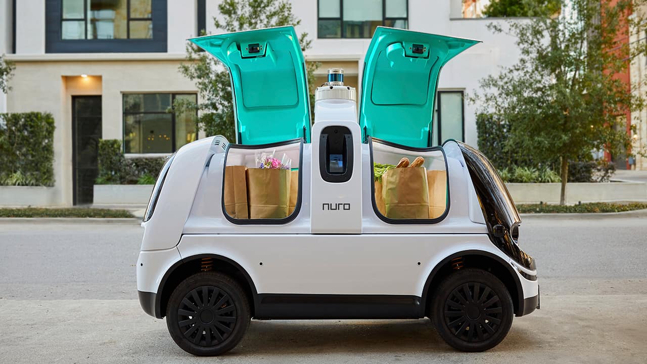 Photo of Nuro's self-driving vehicle "R2" carrying bags of groceries