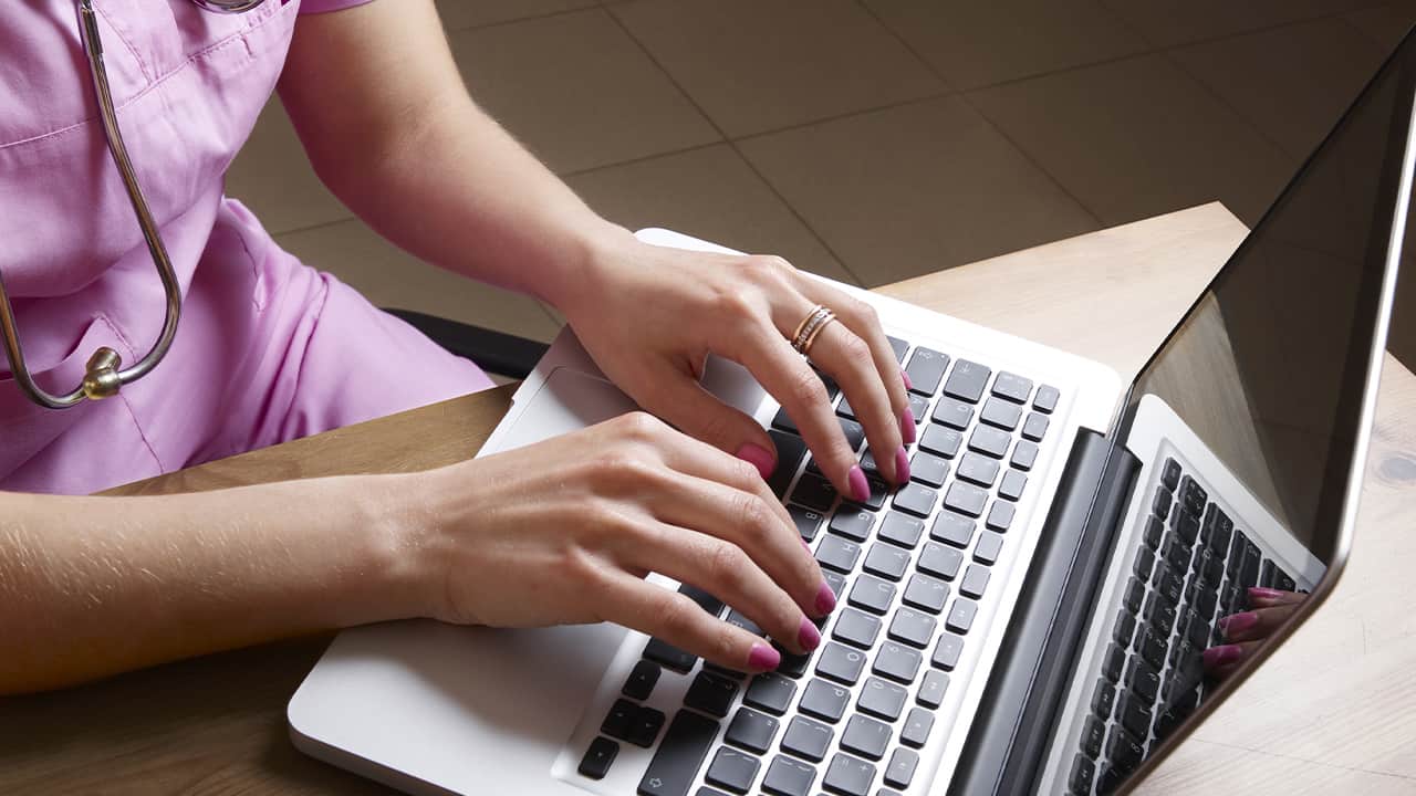 Photo of a nursing student working on a laptop