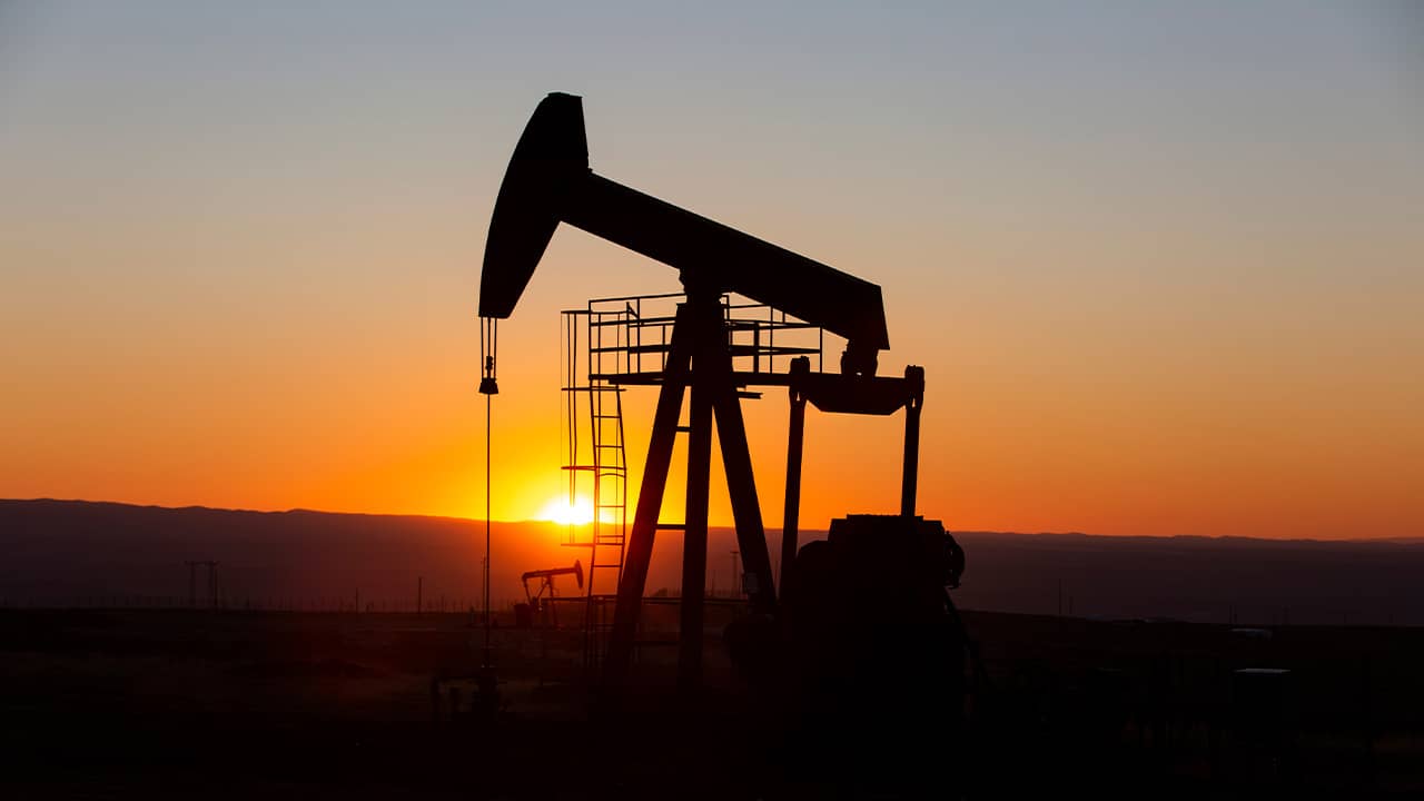 Photo of an oil pump jack in the oil fields