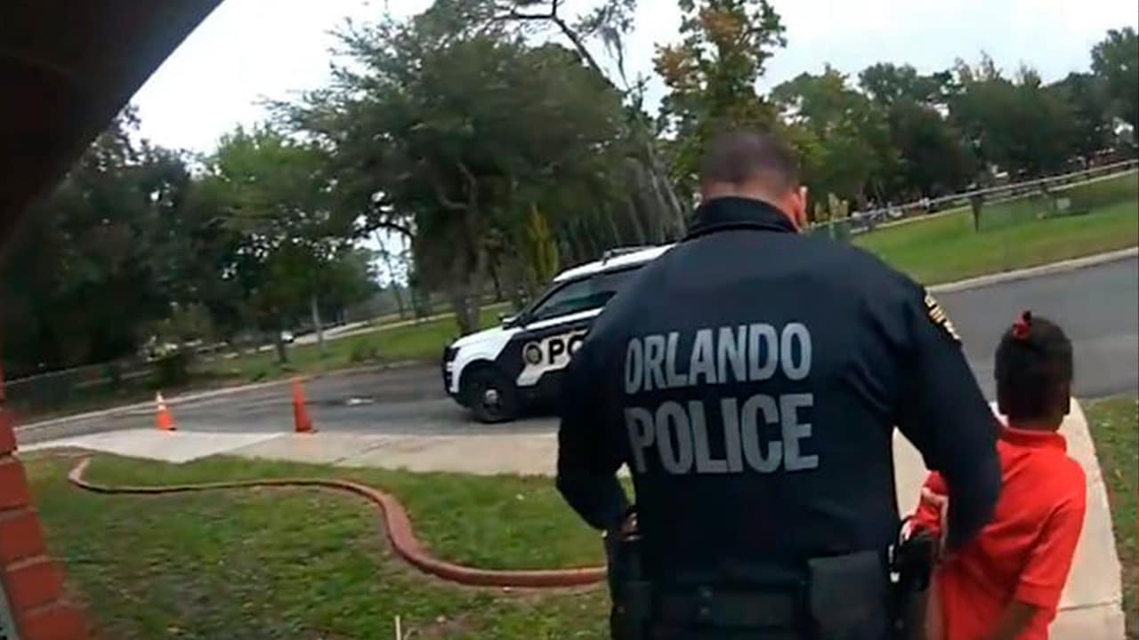 Photo of Orlando police officer Dennis Turner arresting a 6 year old girl
