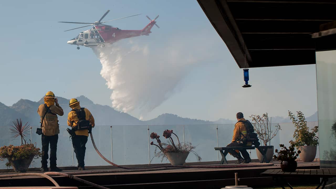 Photo of helicopter dropping water