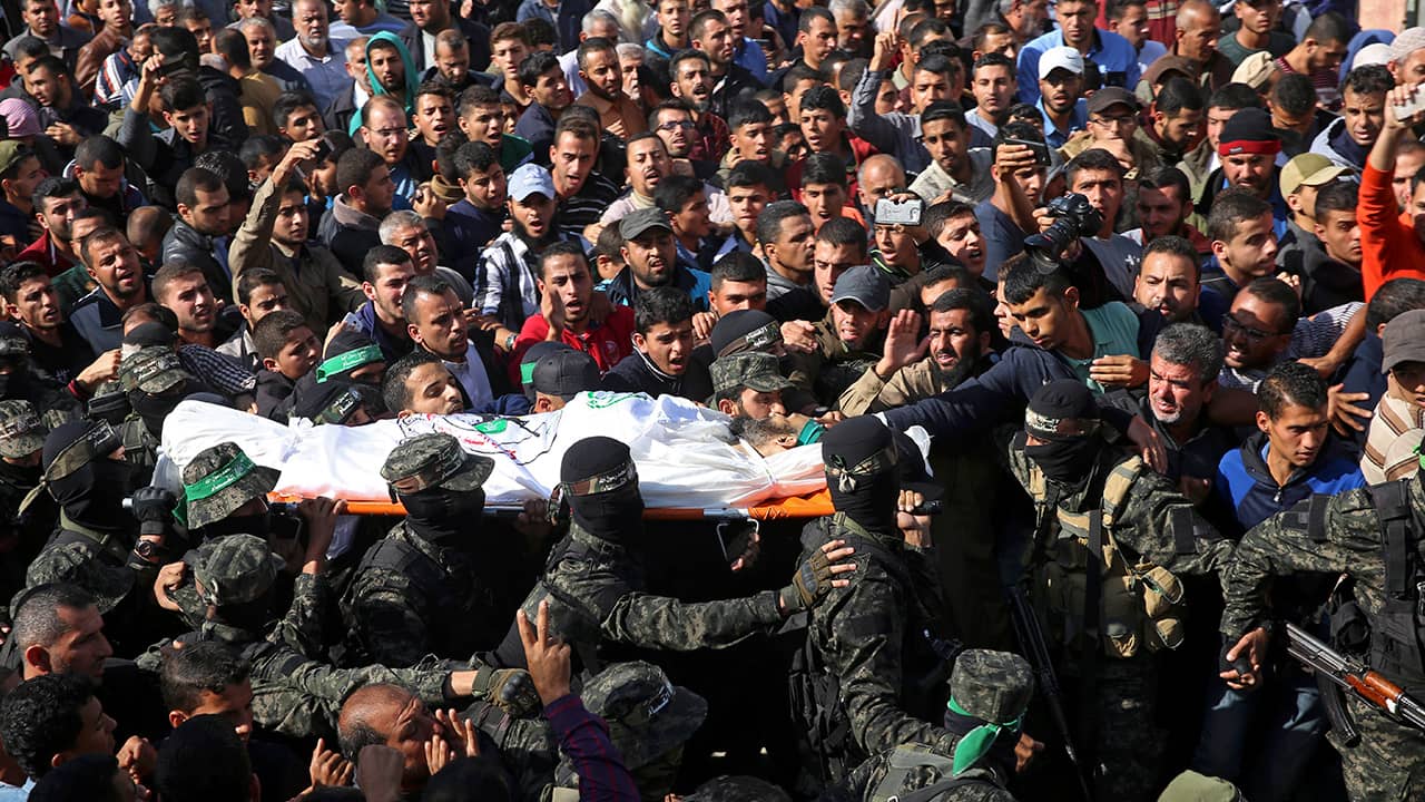 Photo of mourners carrying the body of Nour Baraka