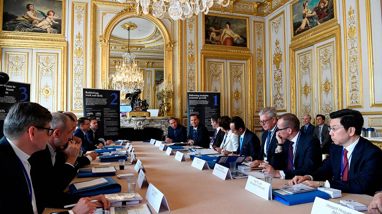 Photo of delegates gathering for "Tech for Good" summit