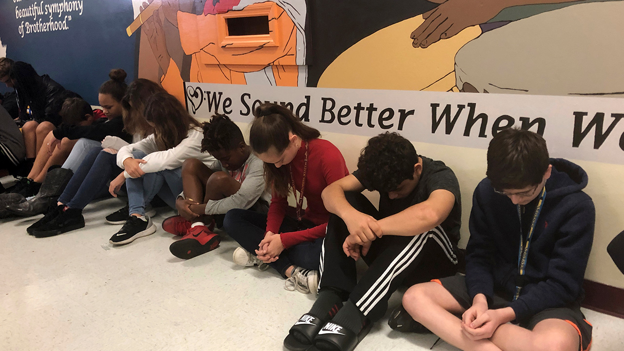 Photo of students taking a moment of silence