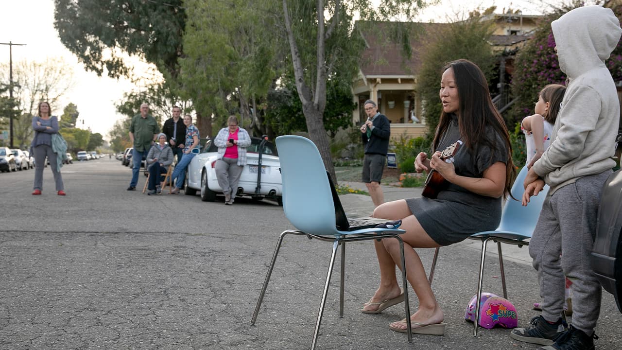 Photo of Patti Wang-Cross playing her ukulele 