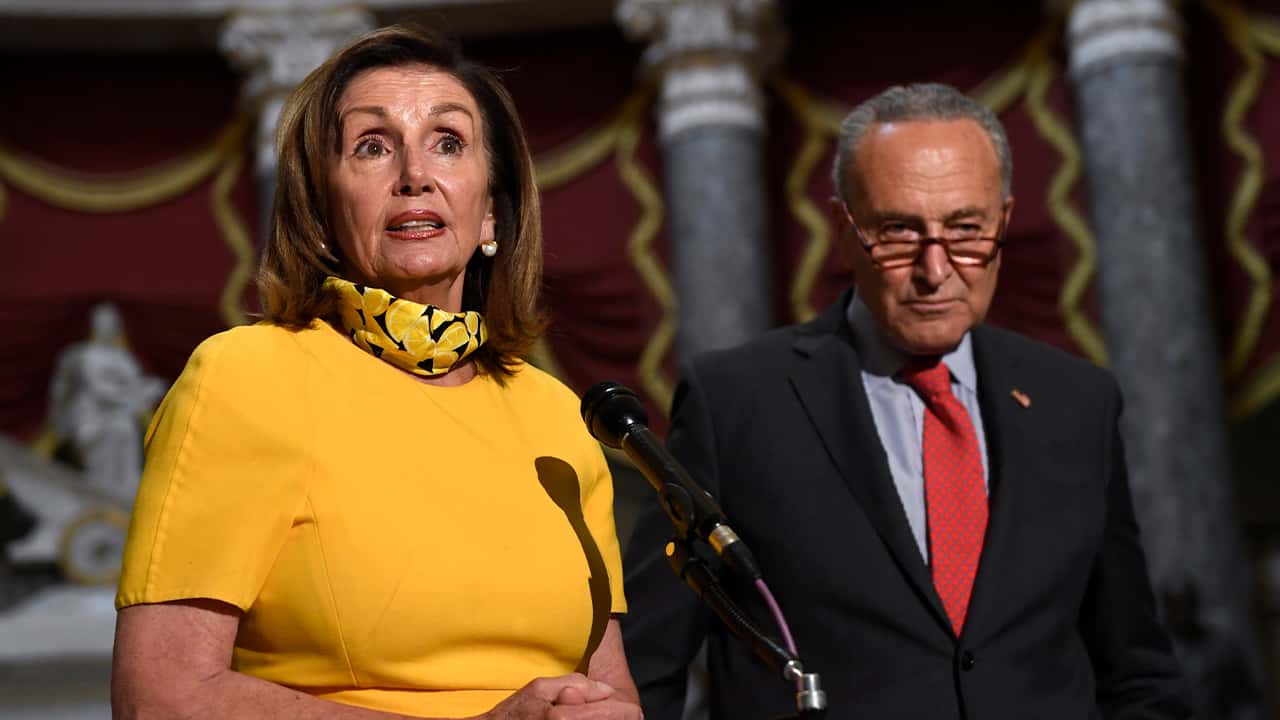 House Speaker Nancy Pelosi of Calif., left, speaks as she stands next to Senate Minority Leader Sen. Chuck Schumer