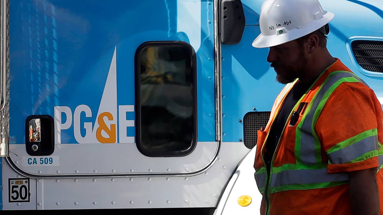 Photo of PG&E worker and PG&E truck