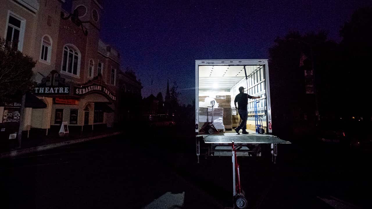 Photo of Armando Espinoza delivering paper products to a cafe in Sonoma, CA