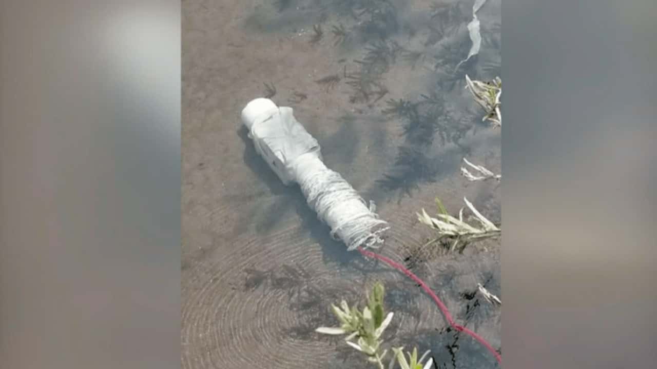 Photo of a pipe bomb underwater