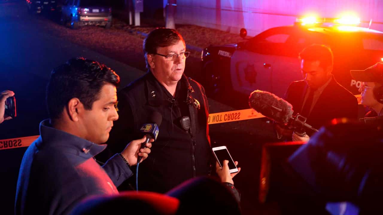 Fresno Deputy Chief Mike Reid talks to reporters