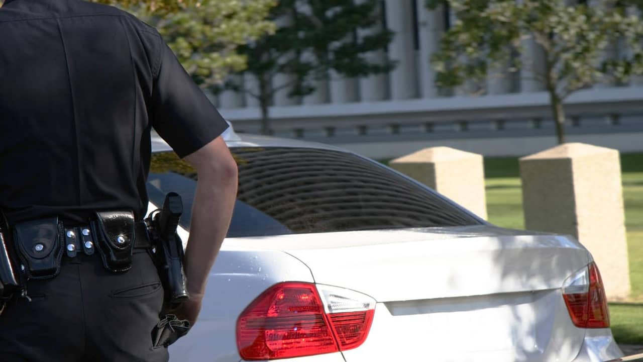 Photo of a police officer walking to a car 