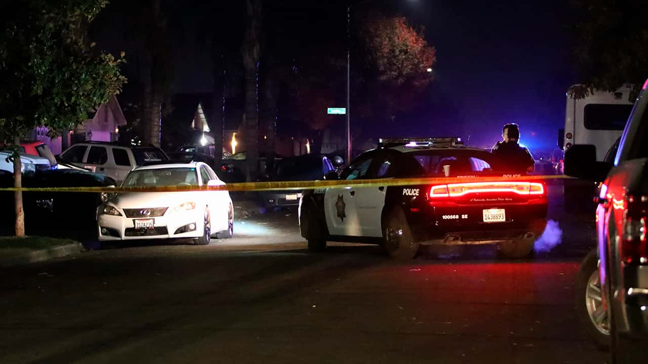 Photo of police working at the scene of the shooting