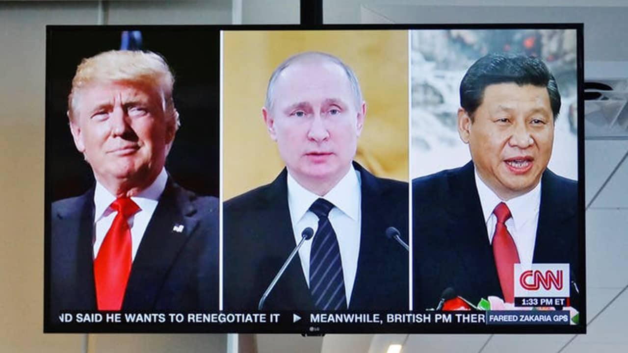 Photo of a TV screen showing politicians