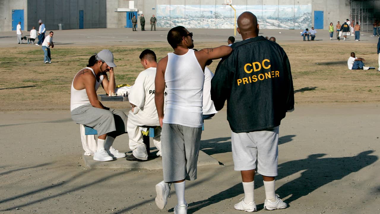 Photo of inmates in the recreation yard at Corcoran State Prison