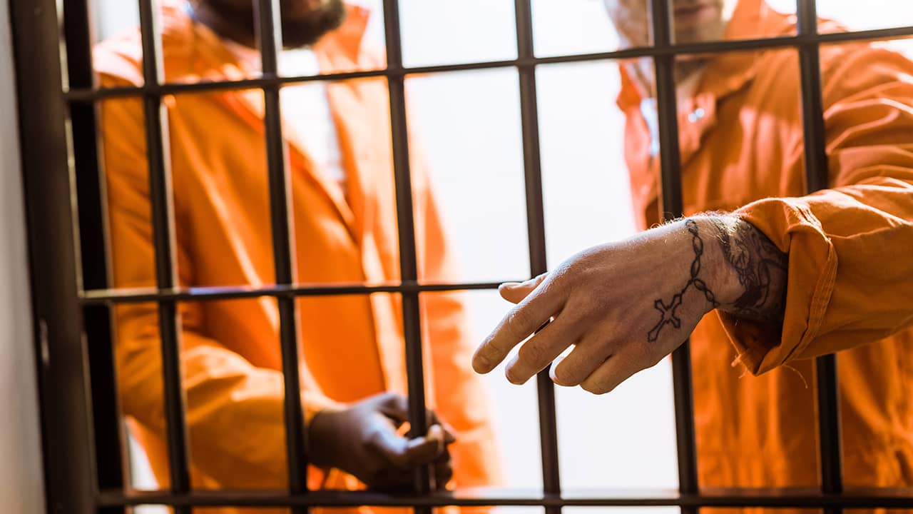 Photo of inmates in a prison cell