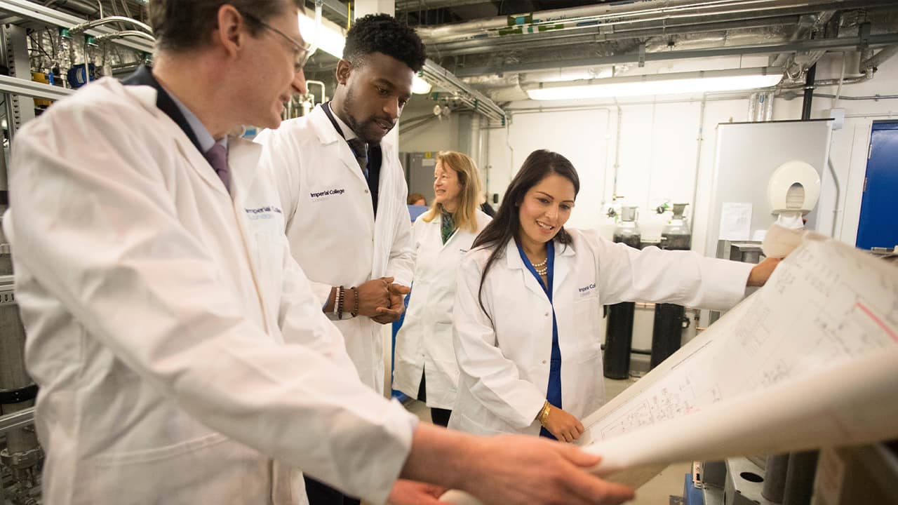 Photo of Britain's Home Secretary Priti Patel with students