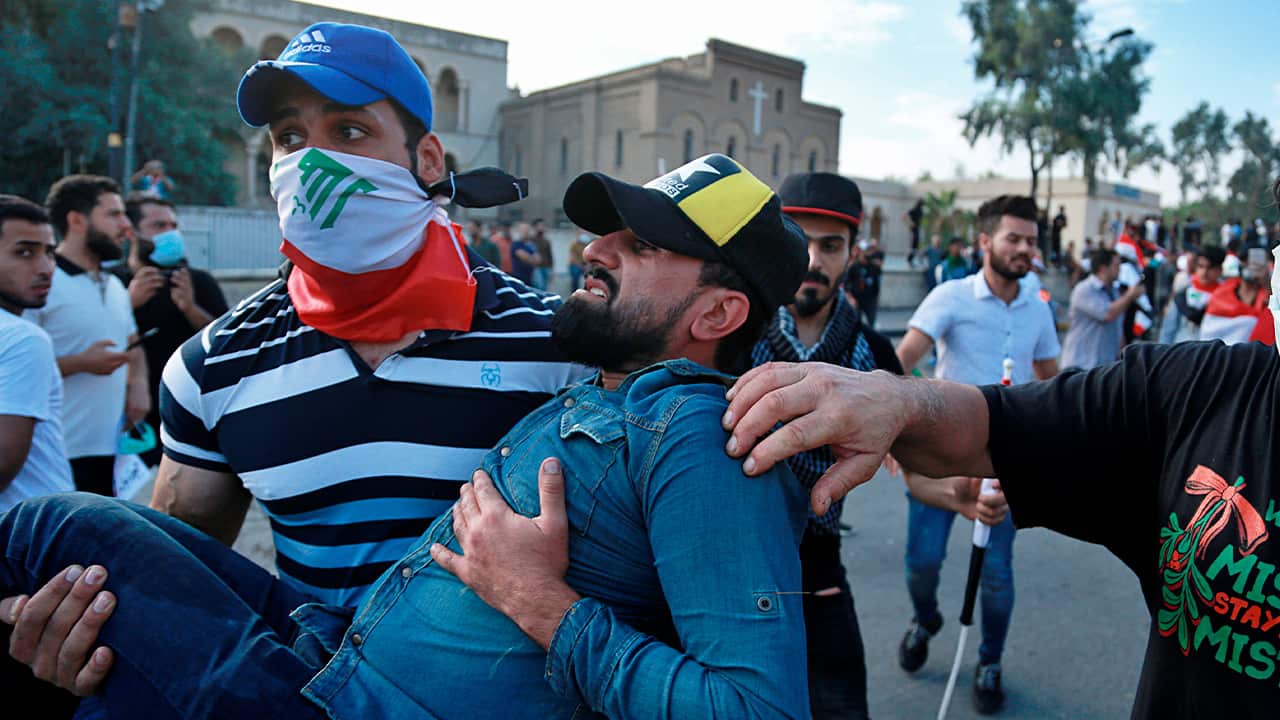 Photo of an injured protestor being carried