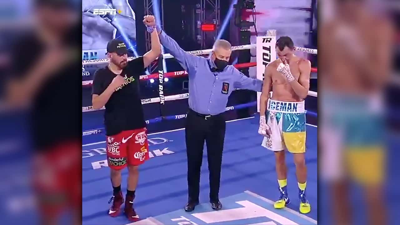 Photo of referee raising Jose Ramirez's hand in victory