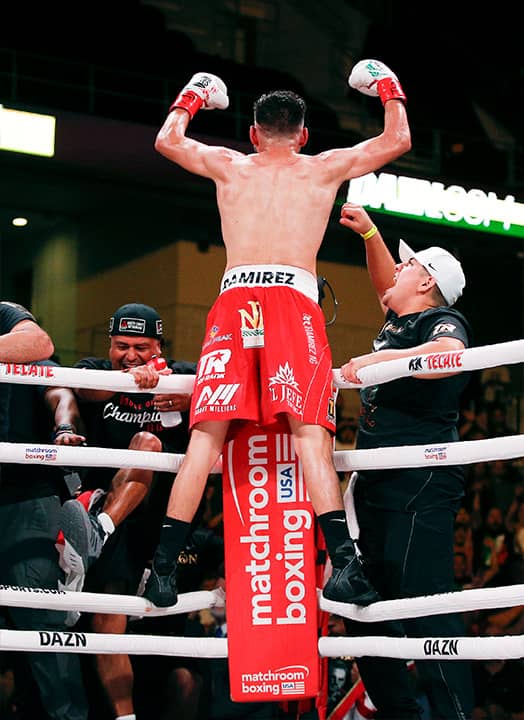Photo of Jose Ramirez celebrating TKO victory over Maurice Hooker