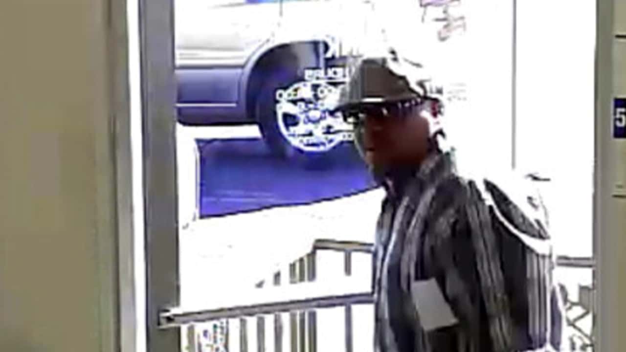 Image of man wearing a cap who robbed the WestAmerica Bank in Easton, California, in 2014