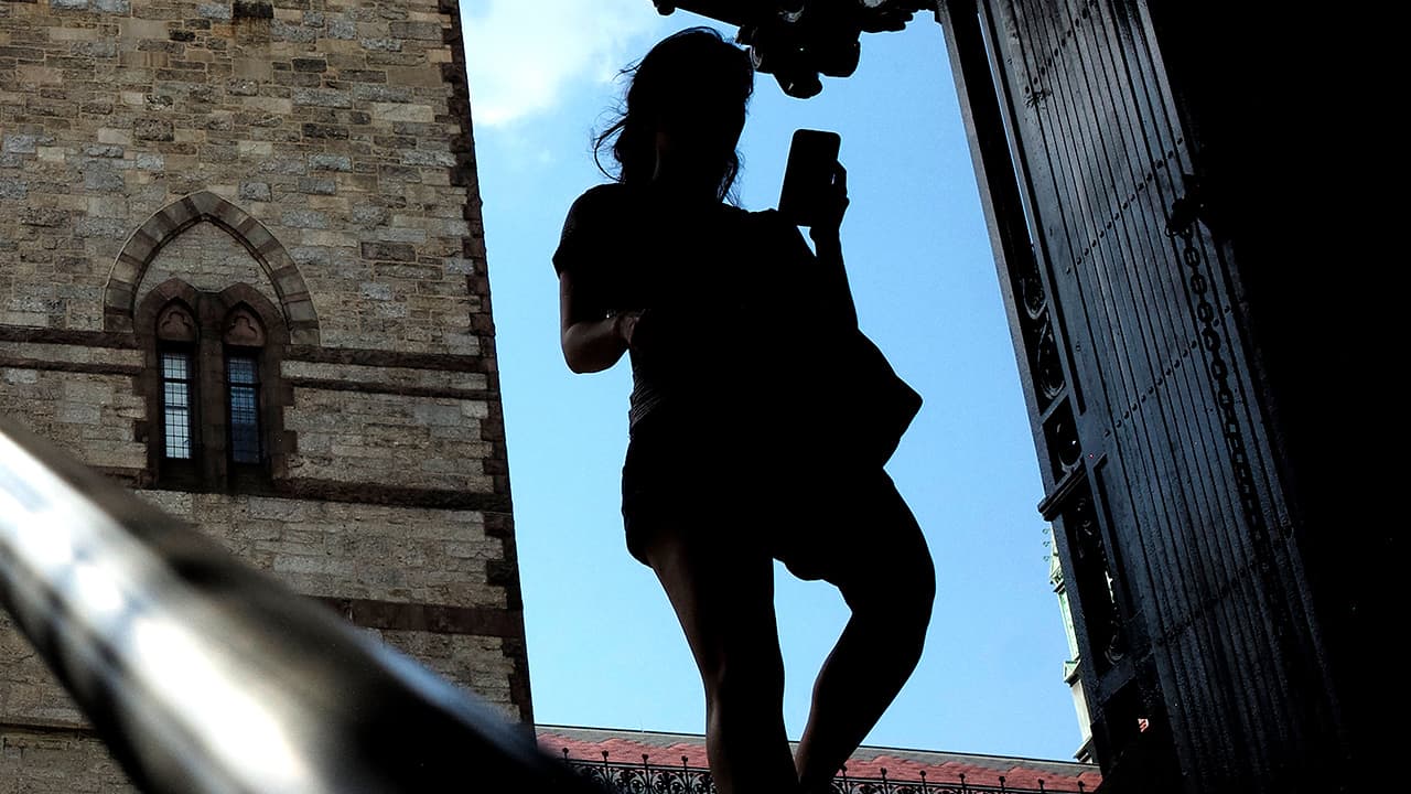 Photo of a woman looking at her phone