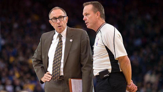 Photo of Golden State Warriors assistant coach Ron Adams and an NBA referee