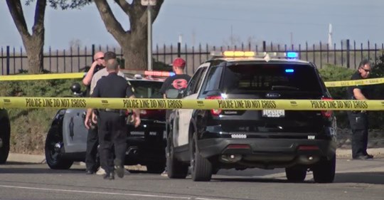 Photo of Fresno police investigating a homicide scene
