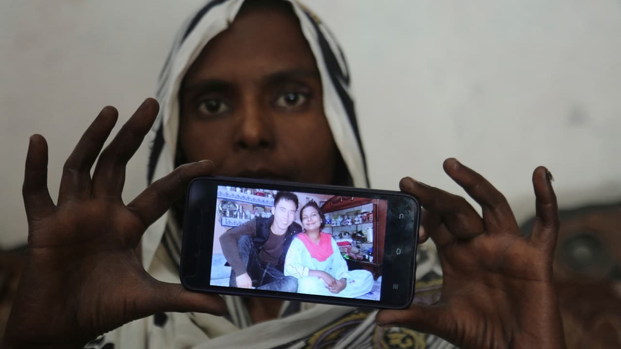 Photo of Pakistani Christian woman Samiya David showing a picture her picture with her Chinese husband
