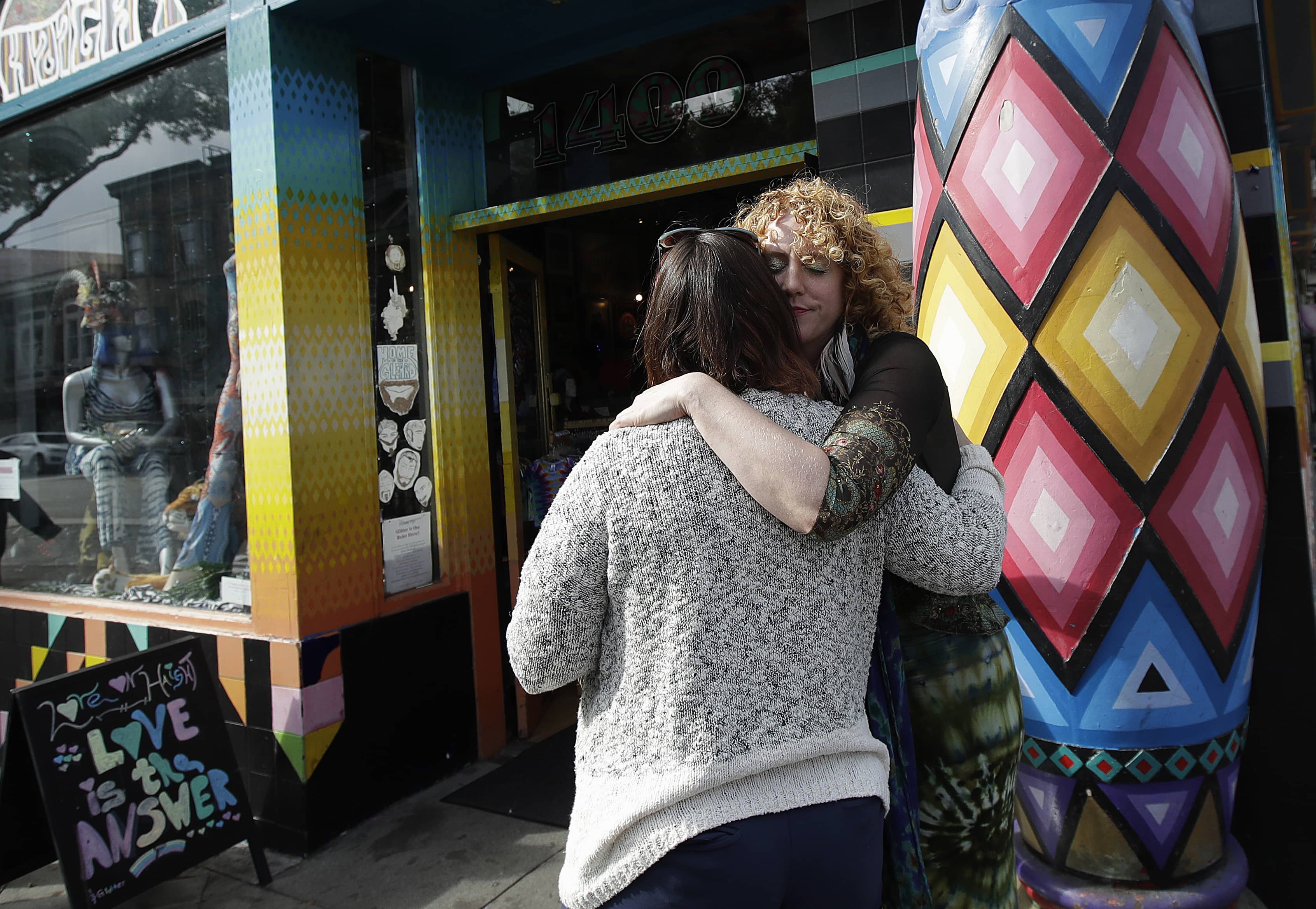 Photo of San Francisco shop owners hugging