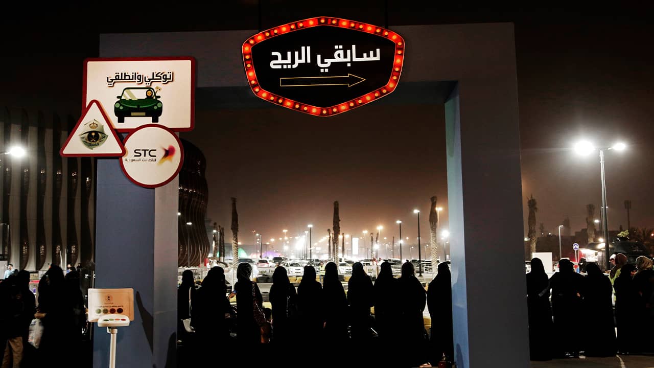 Photo of women waiting to ride go carts