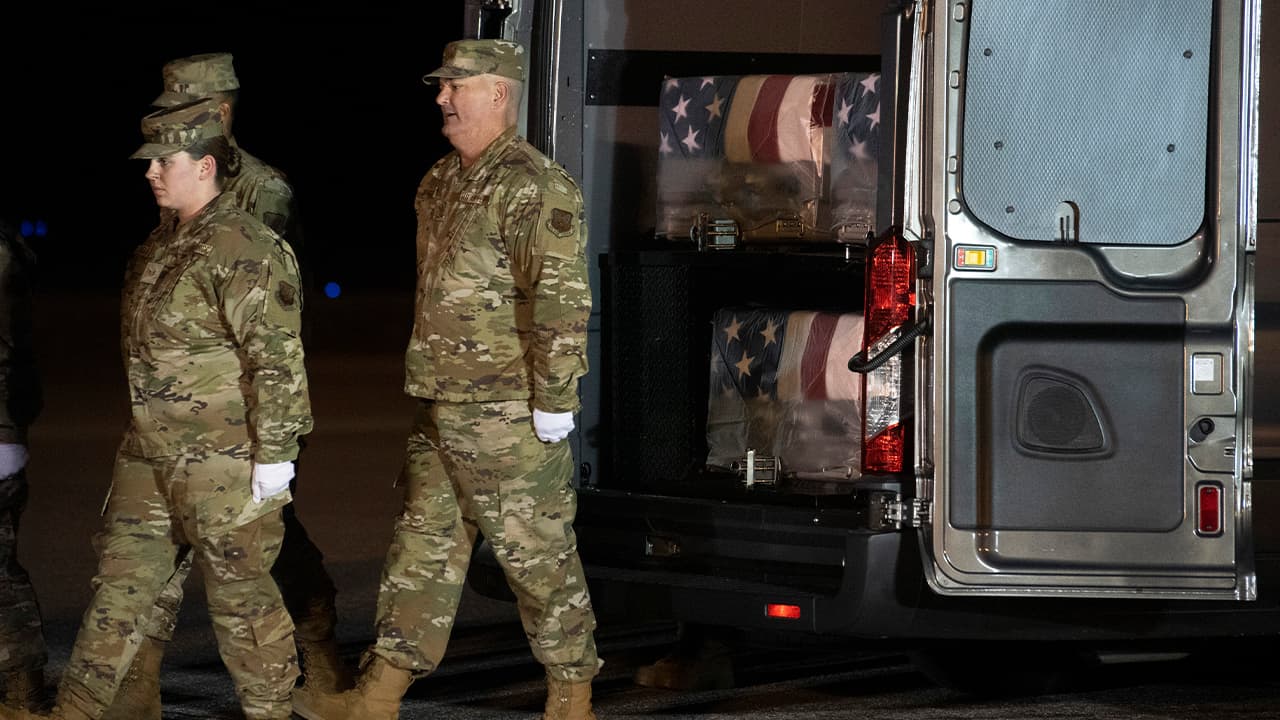 Photo of an Air Force carry team marching away from the transfer cases