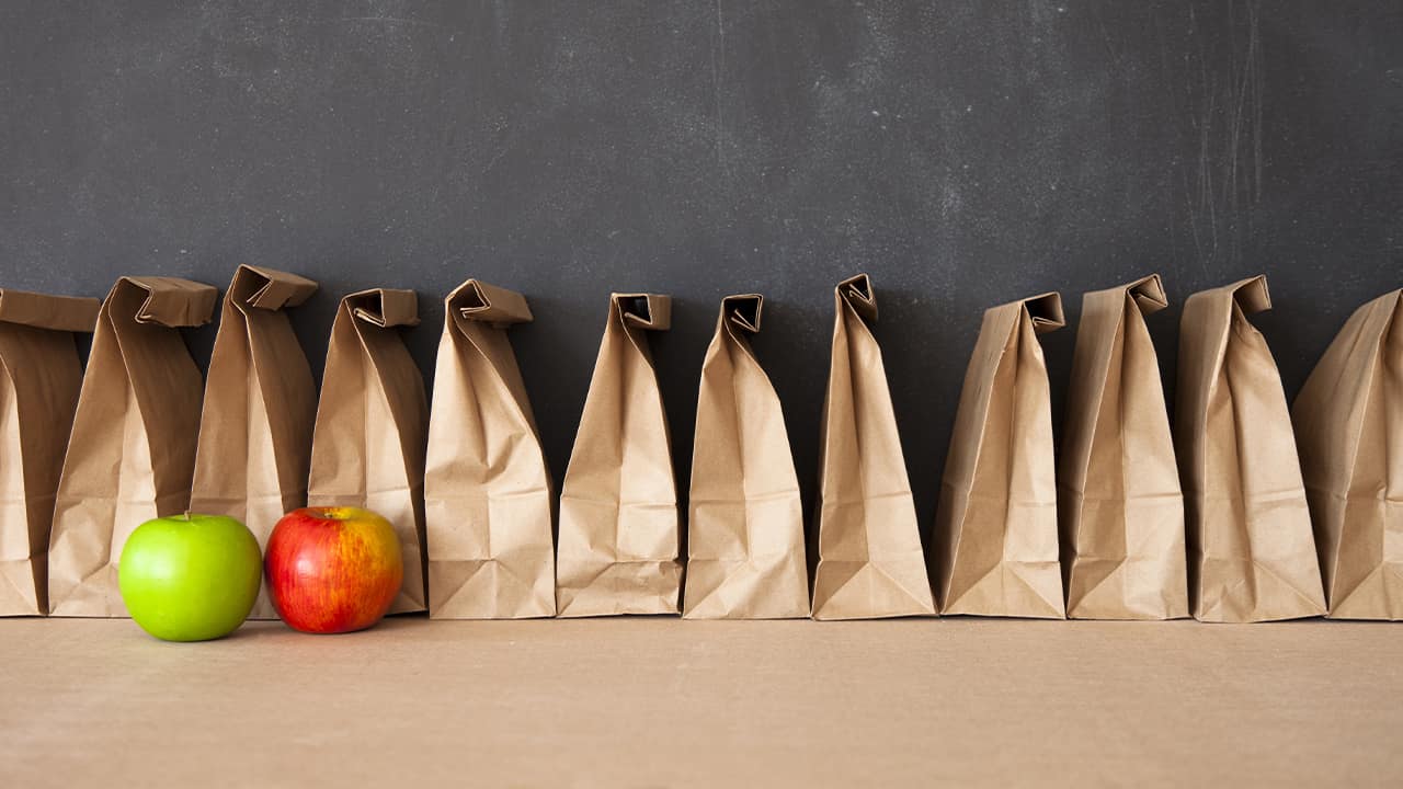 Photo of school lunches against a blackboard